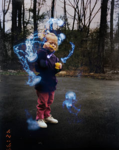 A child surrounded by semi-transparent blue wisps.