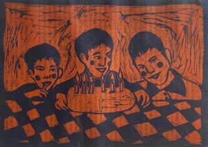 A red and black drawing of three kids in front of a birthday cake.