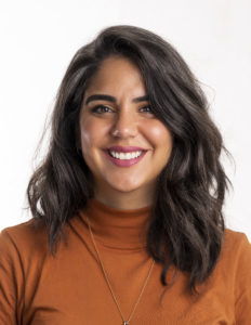 portrait photograph of Elaine Lopez in an orange top