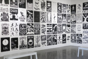 Grid of black and white posters in the exhibit.